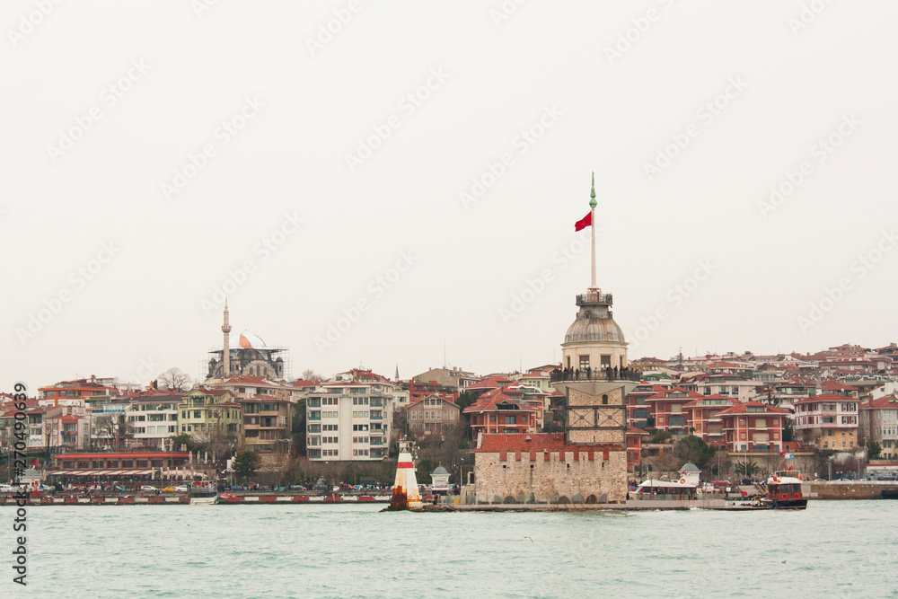 Fototapeta premium Maiden's Tower which is one of the main touristic symbols of the city is located between European and Asian sides of Istanbul, Turkey. 