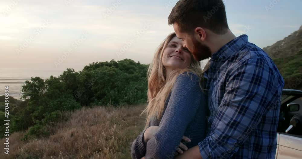 Romantic couple on road trip holiday with convertible car Romantic couple on road trip holiday with convertible car