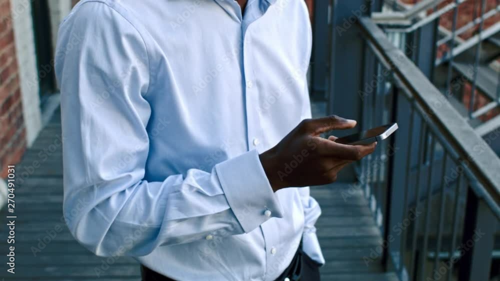African man using digital tablet phone African man using digital tablet phone