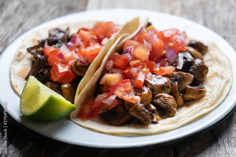 Vegan and vegetarian mexican mushrooms tacos with sauce and lime Vegan and vegetarian mexican mushrooms tacos with sauce and lime