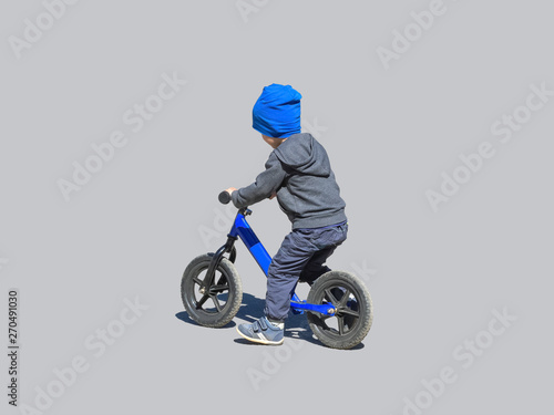 Little boy on a balancing Bicycle photo