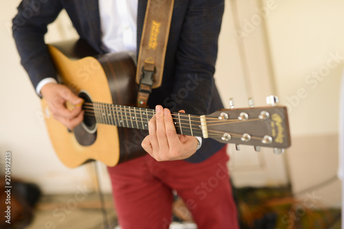 The musician plays the guitar