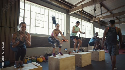 Group of people in crossfit class in gym