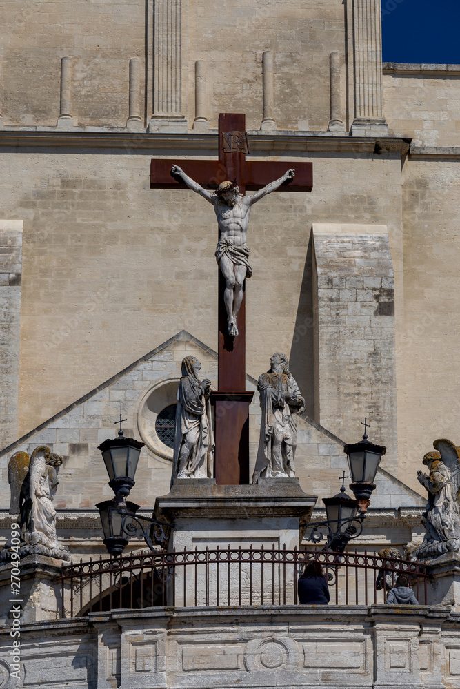 Avignon. Sculpture from a tree of the crucified Christ on an iron cross.