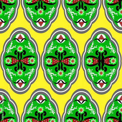 abstract floral ornament of green and red colors on a yellow background