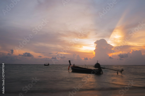 Good evening background sky and Thai boat, Beach near Phuket International Airport ,Bright in Phuket Thailand.