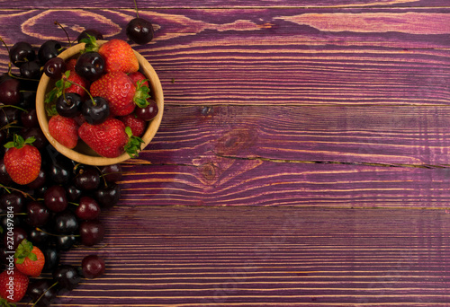 Fresh Summer Berries on Rustic Wooden Background