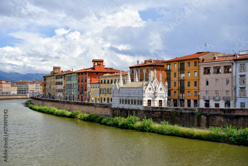 View of the medieval town of Pisa from bridge "Ponte di Mezzo" on river Arno