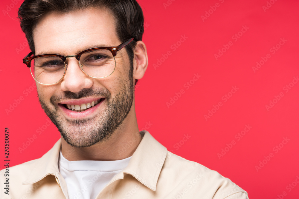 smiling handsome man in glasses looking at camera Isolated On pink smiling handsome man in glasses looking at camera Isolated On pink