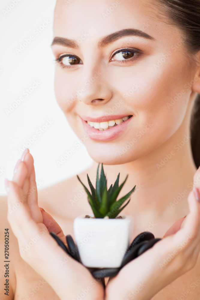 Skin Care. Beauty Woman Face With Healthy Skin And Green Plant Skin Care. Beauty Woman Face With Healthy Skin And Green Plant
