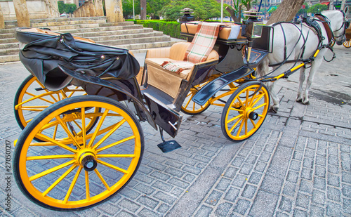 Horse carriage waiting for tourists in front of Seville Santa Maria cathedral