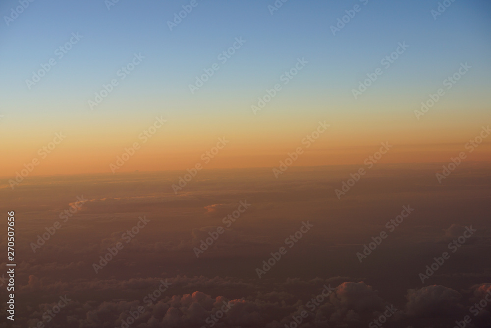 Fototapeta premium Aerial of Sunrise light over the world full of clouds