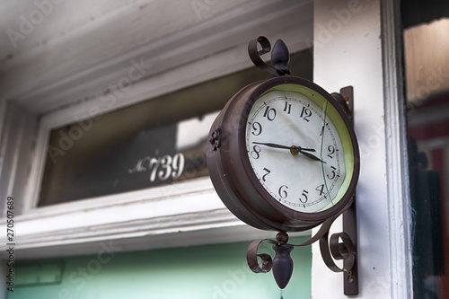 Abstract building wall with antique clock