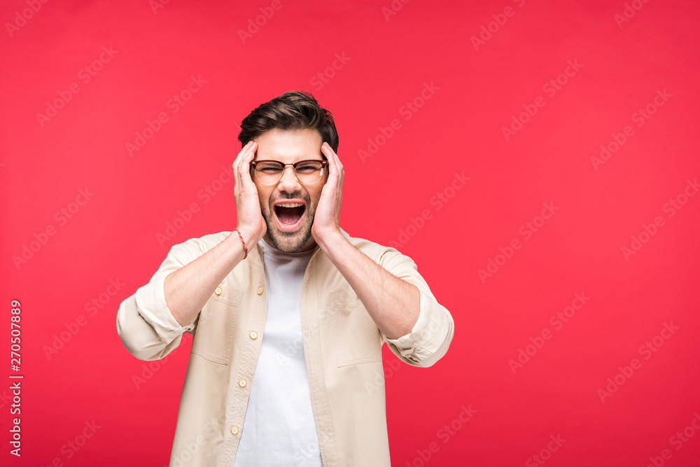 handsome man with Hands on head screaming Isolated On pink handsome man with Hands on head screaming Isolated On pink