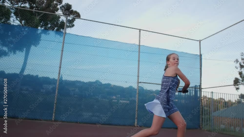 Slow motion of young tennis player hitting ball Slow motion of young tennis player hitting ball