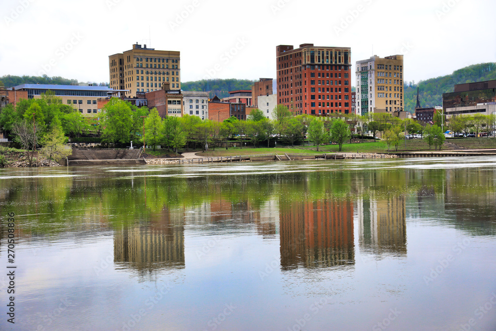 The skyline of Wheeling, West Virginia is reflected in the Ohio River