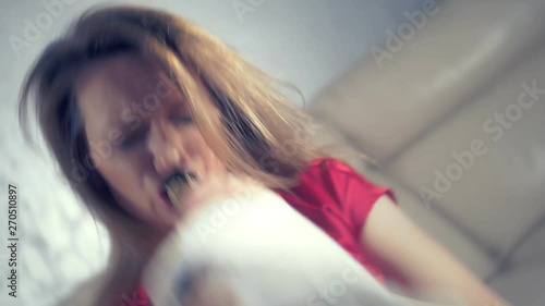 woman gets drunk at home alone at a table set for two for a romantic date, as her partner did not come on a date
