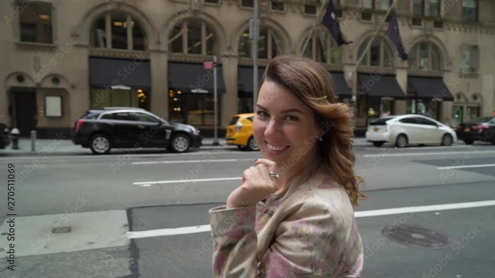 Young woman walking in a city street Young woman walking in a city street