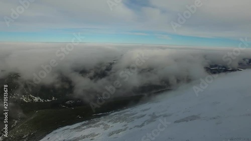 Between Clouds Aerial Panorama Over Mountain Peaks High Altitude Above Sea Level 4k photo