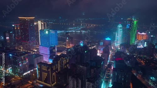 night time illumination macau city bay famous downtown hotel aerial panorama 4k china photo