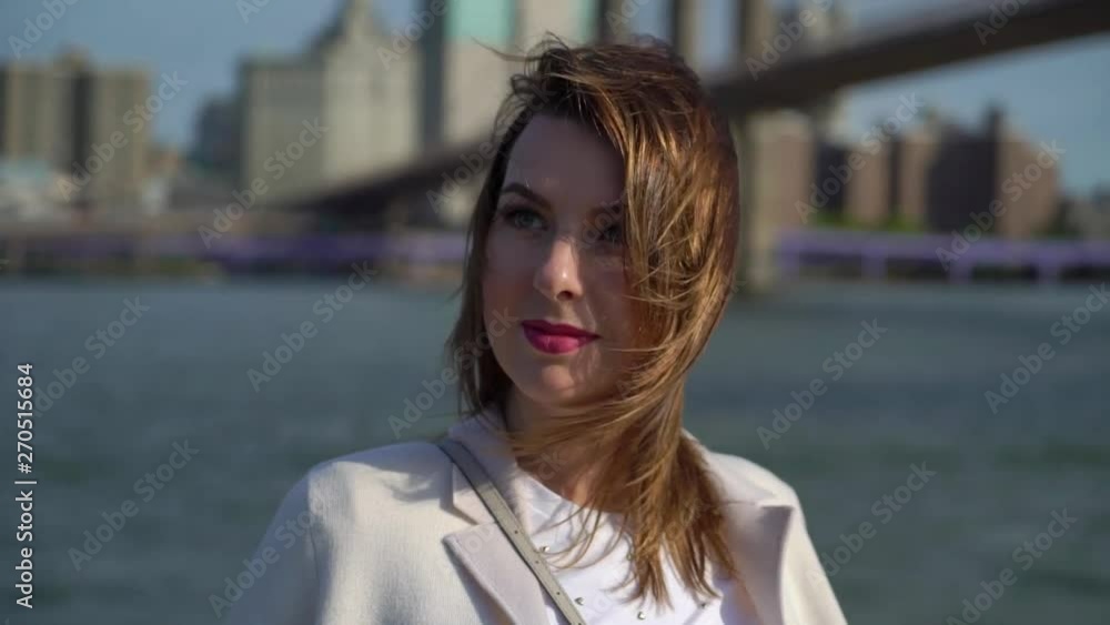 Young woman near Brooklyn bridge embankment walking Young woman near Brooklyn bridge embankment walking