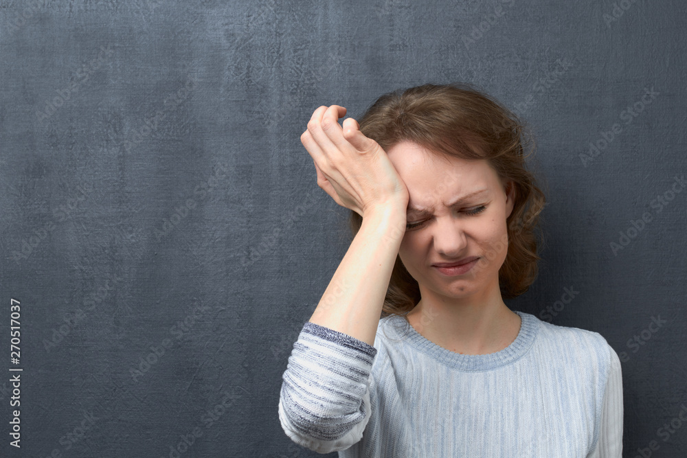 Portrait of unhappy woman suffering from headache Portrait of unhappy woman suffering from headache
