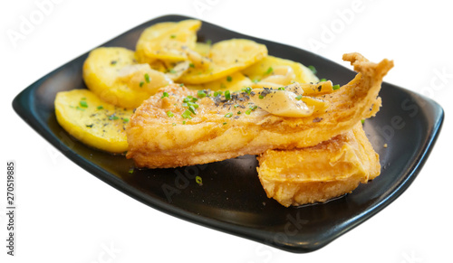 Fried skate wings and potatoes