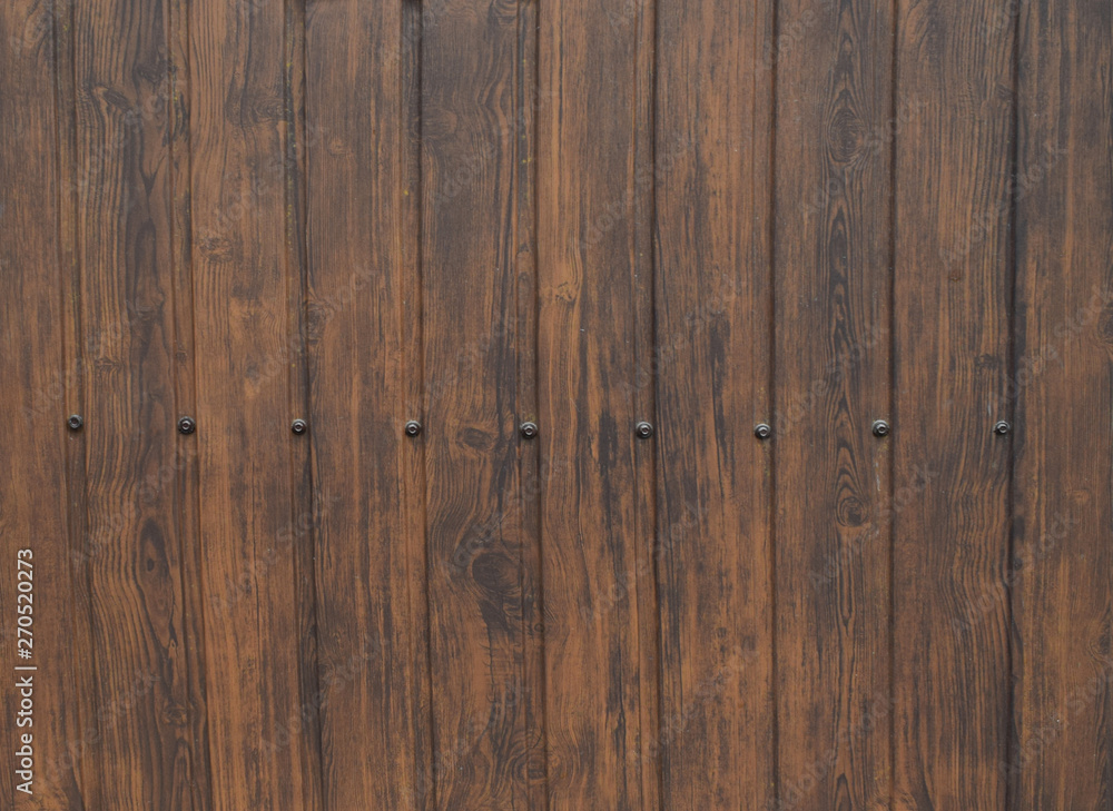 Wood texture background surface with old natural pattern. Wooden brown planks for house gate. Wood texture background surface with old natural pattern. Wooden brown planks for house gate.