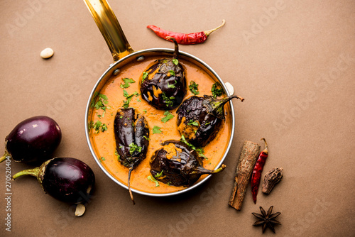 Baingan masala / Eggplant / brinjal curry served in bowl or pan, selective focus