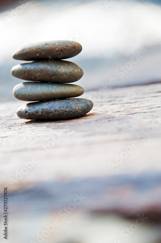 Zen stone on beach for perfect meditation, stack of pebble stones on balance on sand, Pebbles and sand stone composition, Zen stones garden, pile of balanced stone