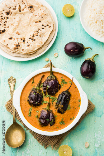 Baingan masala / Eggplant / brinjal curry served with chapati and rice, selective focus photo