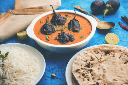 Baingan masala / Eggplant / brinjal curry served with chapati and rice, selective focus photo