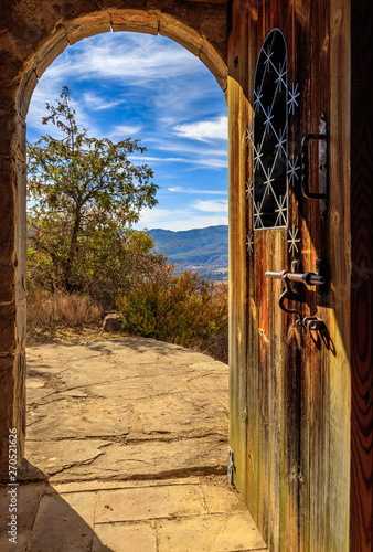 Gate to paradise somewere in spain orange wood & iron photo