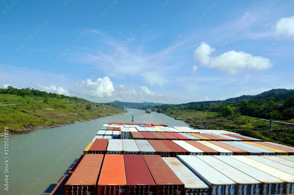 Container ships transiting through Panama Canal.