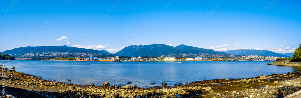 Panorama View of the North Shore of the Vancouver Harbor with Grouse Mountain in the background. Viewed from the Stanley Park Seawall pathway