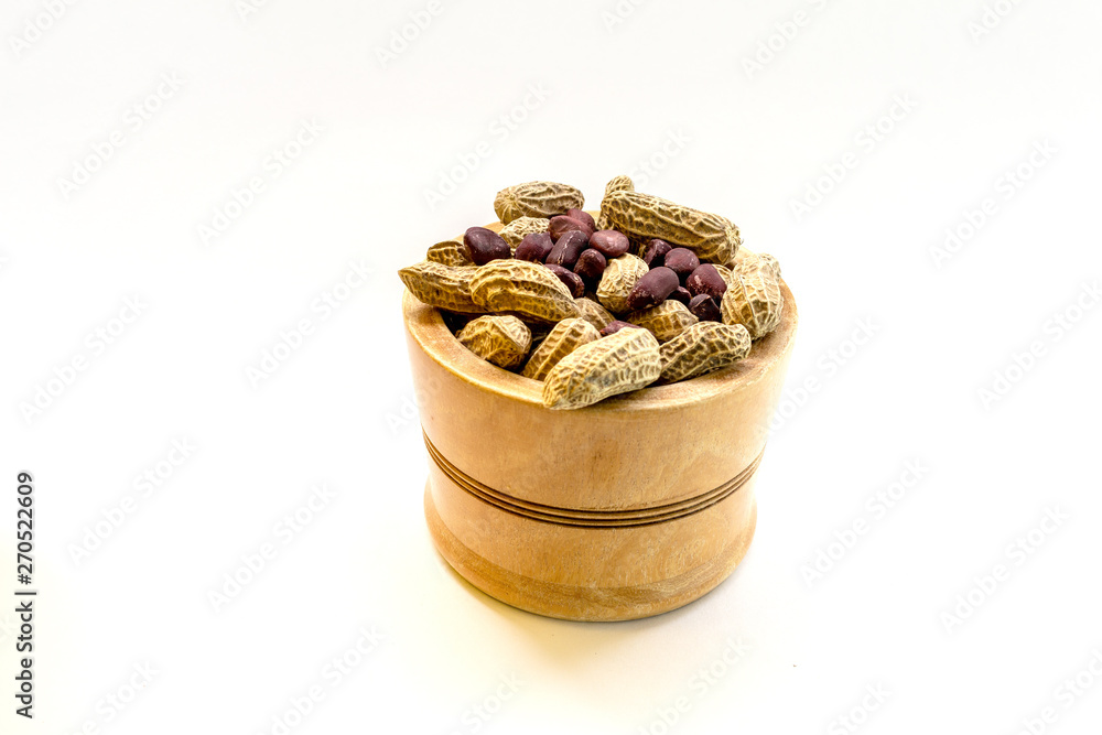 bowl with peanuts in shell on white background bowl with peanuts in shell on white background