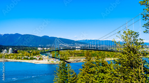 View of the Lions Gate Bridge, a suspension bridge that connects Vancouver's Stanley Park and the municipalities of North Vancouver and West Vancouver. Viewed from the Seawall pathway in Stanley Park 