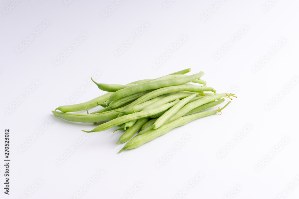 Green bean bunch closeup. Fresh Green bean Also known as French beans, string beans, snap bean, snaps and haricots vert. Green bean bunch closeup. Fresh Green bean Also known as French beans, string beans, snap bean, snaps and haricots vert.