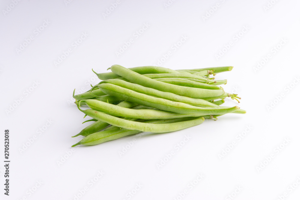 Green bean bunch closeup. Fresh Green bean Also known as French beans, string beans, snap bean, snaps and haricots vert. Green bean bunch closeup. Fresh Green bean Also known as French beans, string beans, snap bean, snaps and haricots vert.