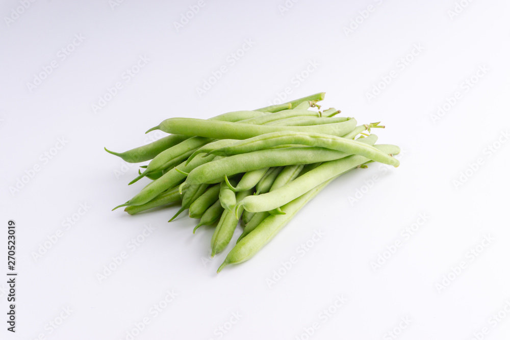 Green bean bunch closeup. Fresh Green bean Also known as French beans, string beans, snap bean, snaps and haricots vert. Green bean bunch closeup. Fresh Green bean Also known as French beans, string beans, snap bean, snaps and haricots vert.