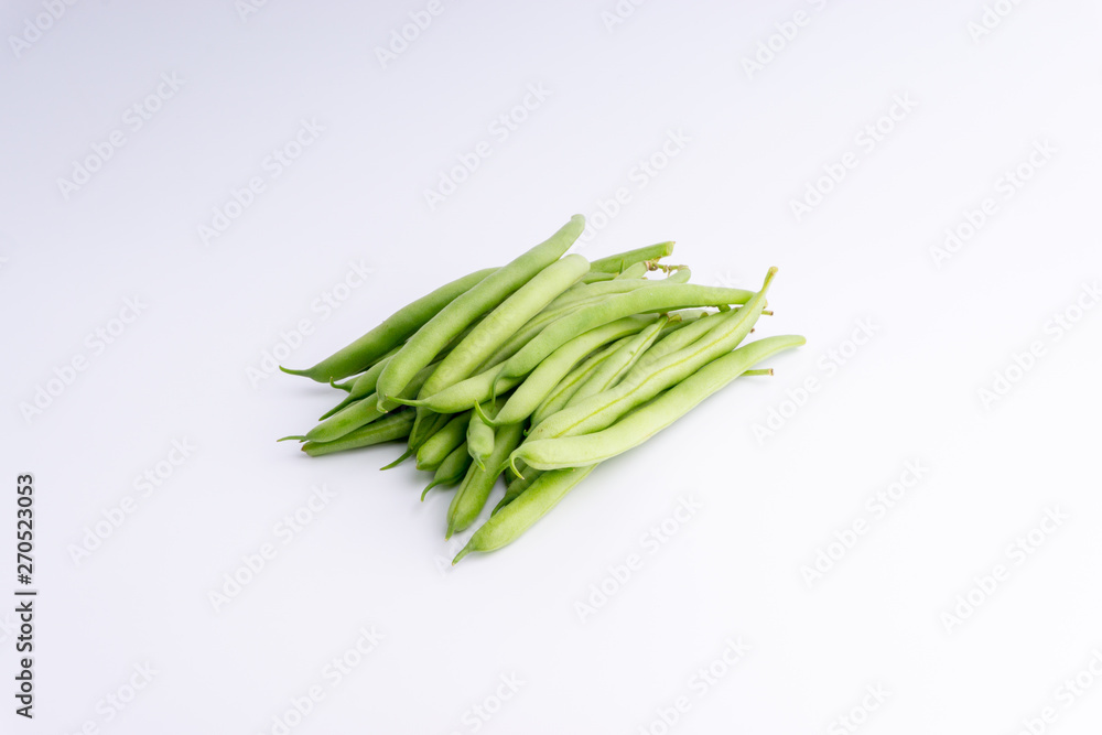 Green bean bunch closeup. Fresh Green bean Also known as French beans, string beans, snap bean, snaps and haricots vert. Green bean bunch closeup. Fresh Green bean Also known as French beans, string beans, snap bean, snaps and haricots vert.