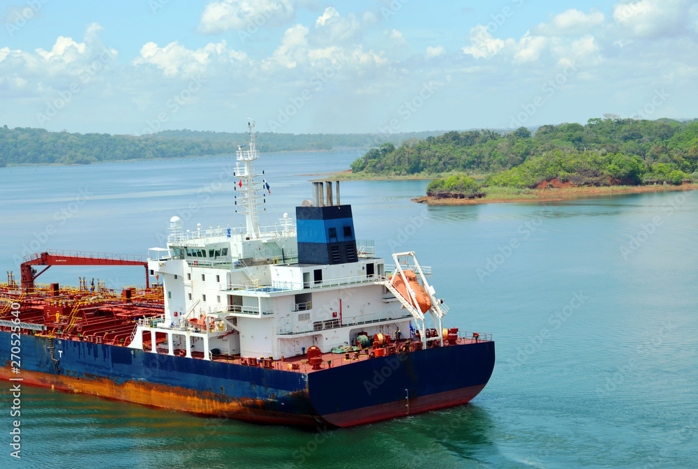 Cargo ship transiting through Panama Canal.