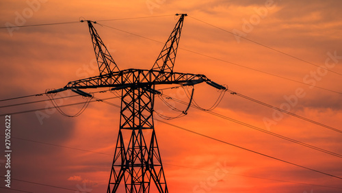 Fotografía Power line pole on the background of sunset and beautiful sky