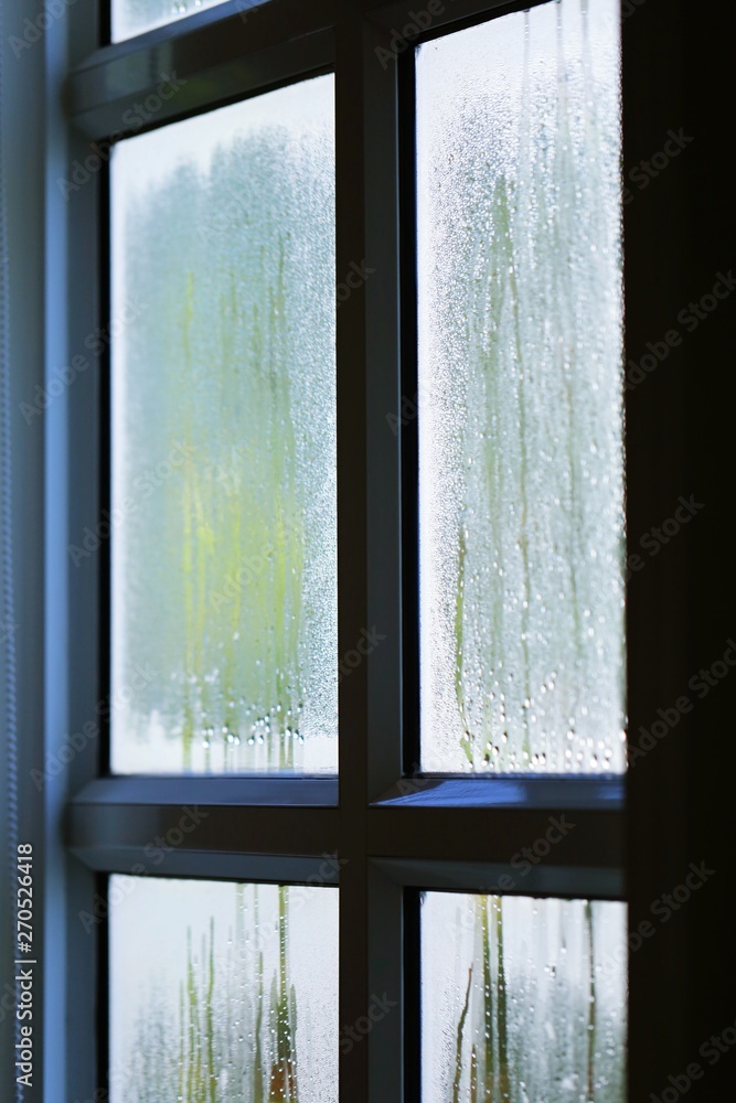 Raindrops on window in fresh morning Raindrops on window in fresh morning