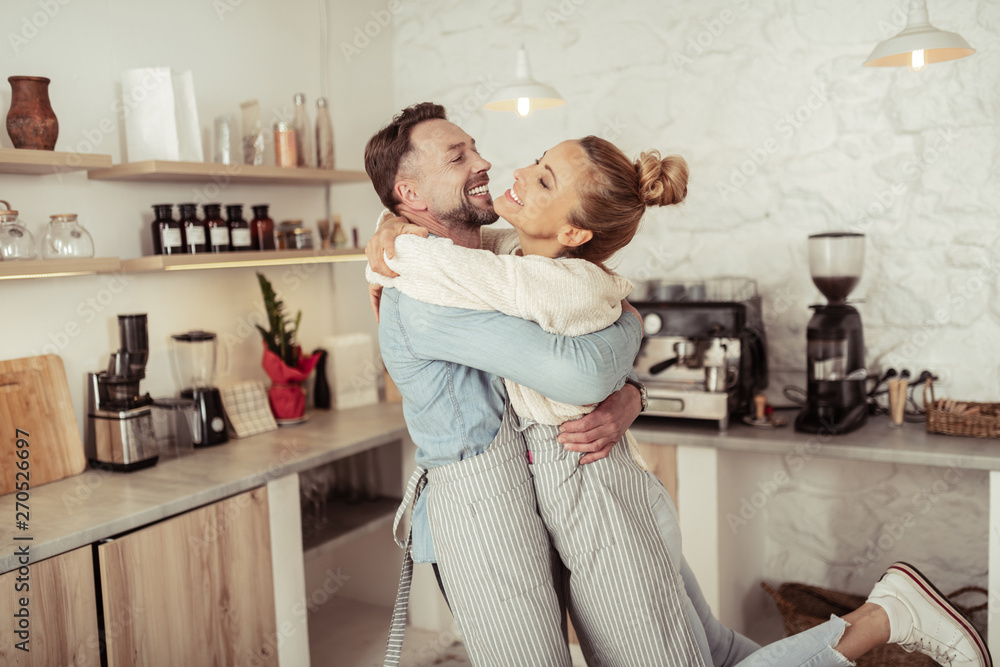 Happy couple clasping in arms of each other. Happy couple clasping in arms of each other.