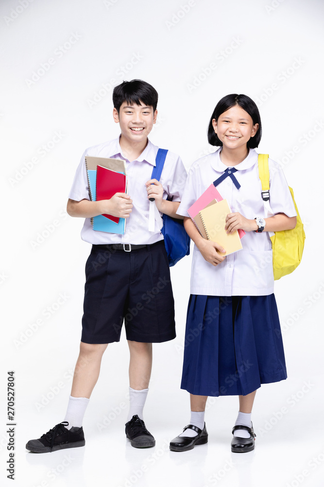 Two asian smiling school kids with colorful stationery, Two asian smiling school kids with colorful stationery,