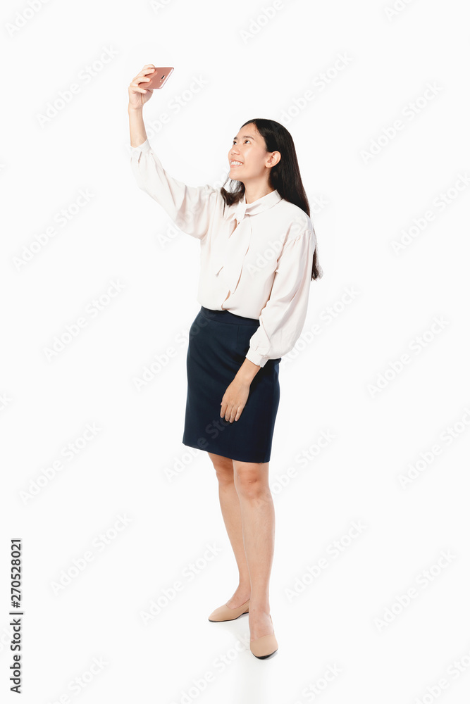 Asian businesswoman using mobile phone over white . Asian businesswoman using mobile phone over white .