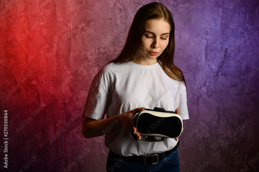 Happy young woman using a virtual reality headset Happy young woman using a virtual reality headset