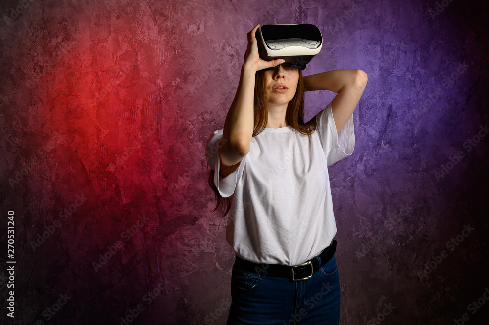 Happy young woman using a virtual reality headset Happy young woman using a virtual reality headset