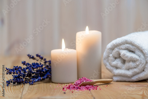 lavender, burning candles and sea salt for spa treatment and relaxation objects close up